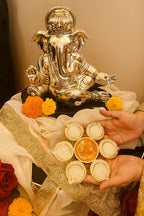 Golden Lotus Rangoli Candle Set – 6 Diyas with Center Laddu Candle